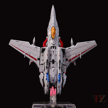 Rear view of Collection Space CS-03 Starqueen Starscream jet mode figure, gray with red accents, orange nose, blue details, on clear stand.