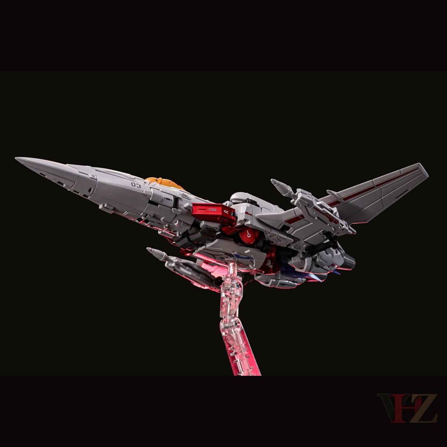 Collection Space CS-03 Starqueen Starscream Mecha Girl in jet mode, gray/red/blue body, on clear stand against black.