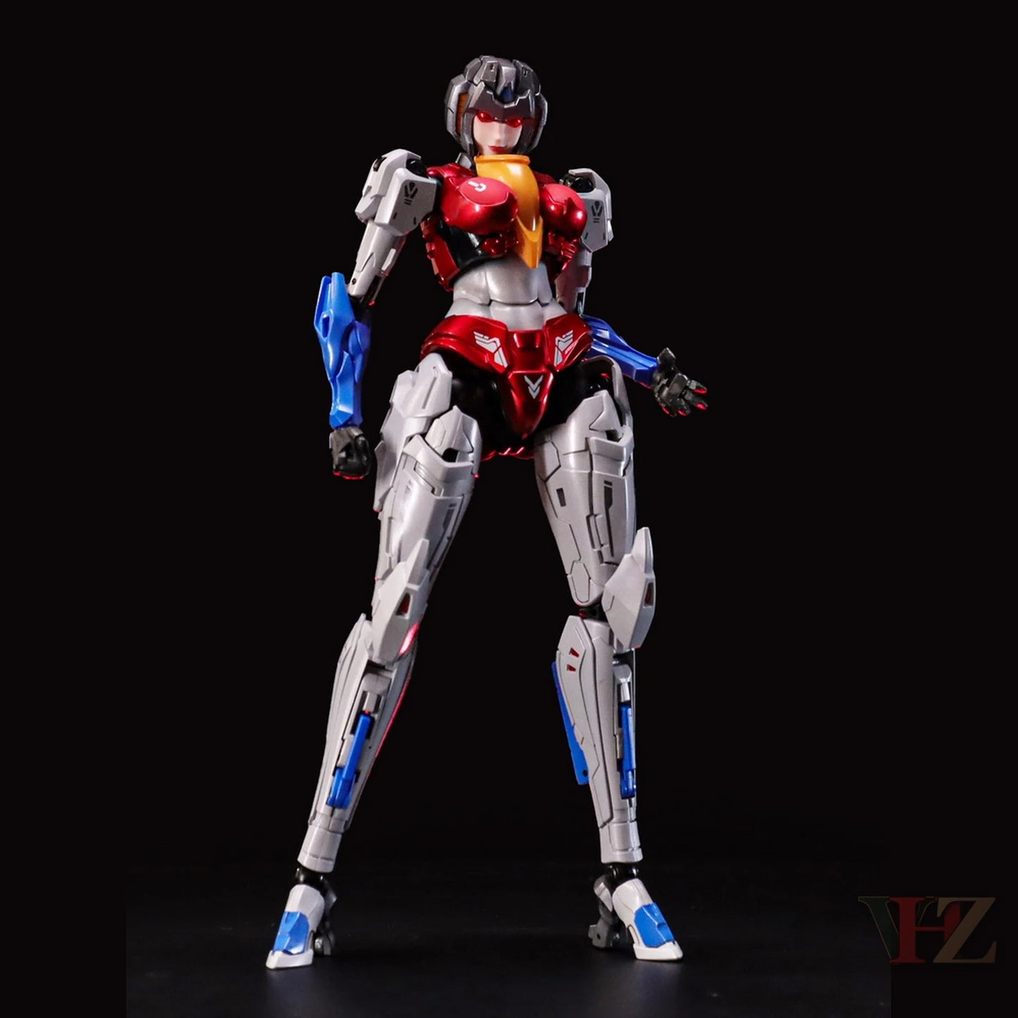 Front view of Collection Space CS-03 Starqueen Starscream mecha girl figure, red and yellow chest, blue arms, silver legs, red eyes against black background.