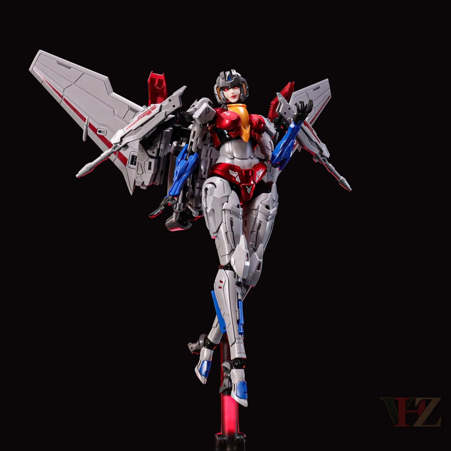 Collection Space CS-03 Starqueen Starscream Mecha Girl in dynamic pose with red, silver, blue armor, large mechanical wings, display stand against black background.