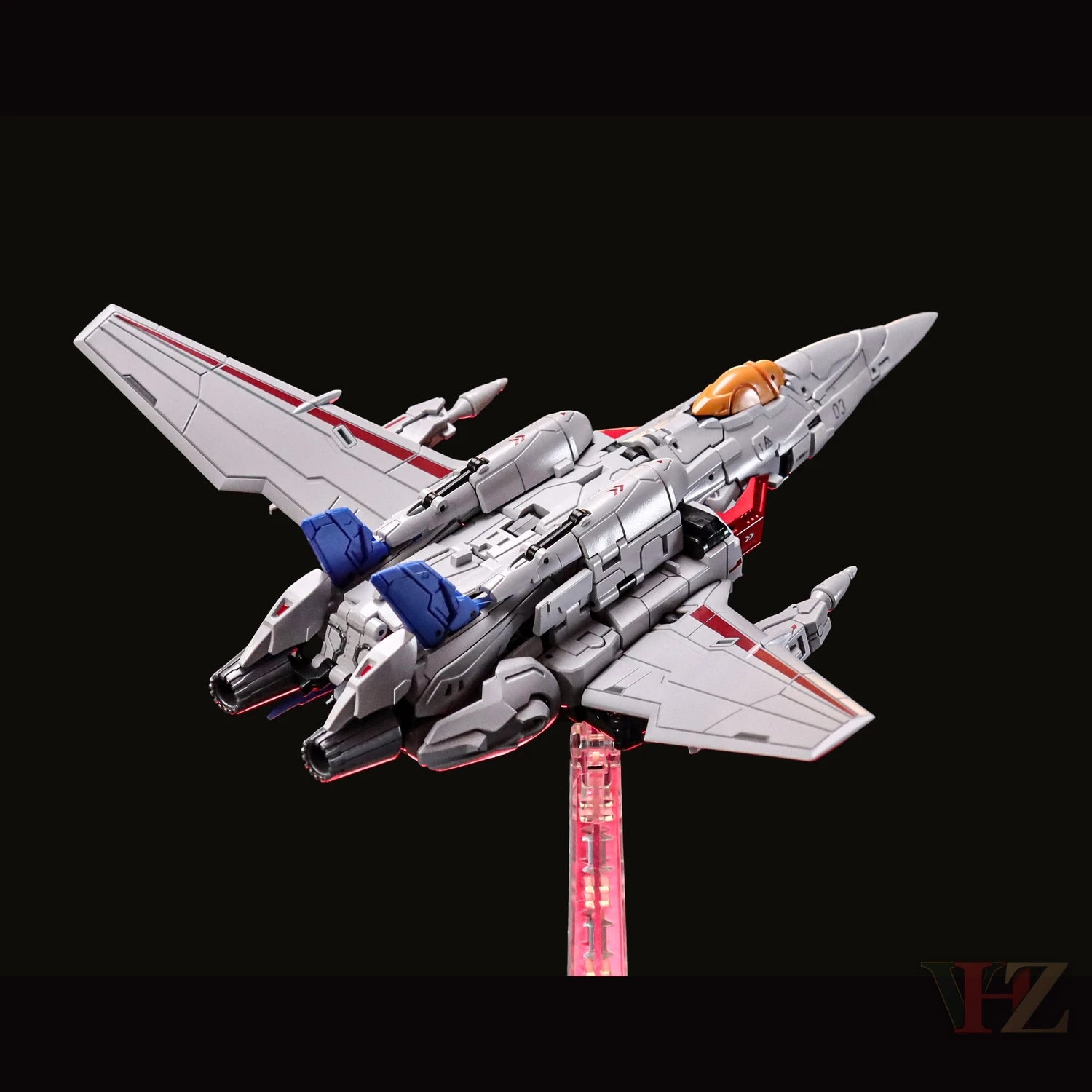 Collection Space CS-03 Starqueen Starscream Mecha Girl in jet mode, gray with red/blue accents, detailed cockpit, display stand against black background.