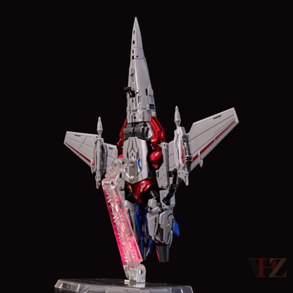 Angled rear view of Collection Space CS-03 Starqueen Starscream jet mode figure, silver with red and blue details, mechanical components, on clear stand with pink accents.